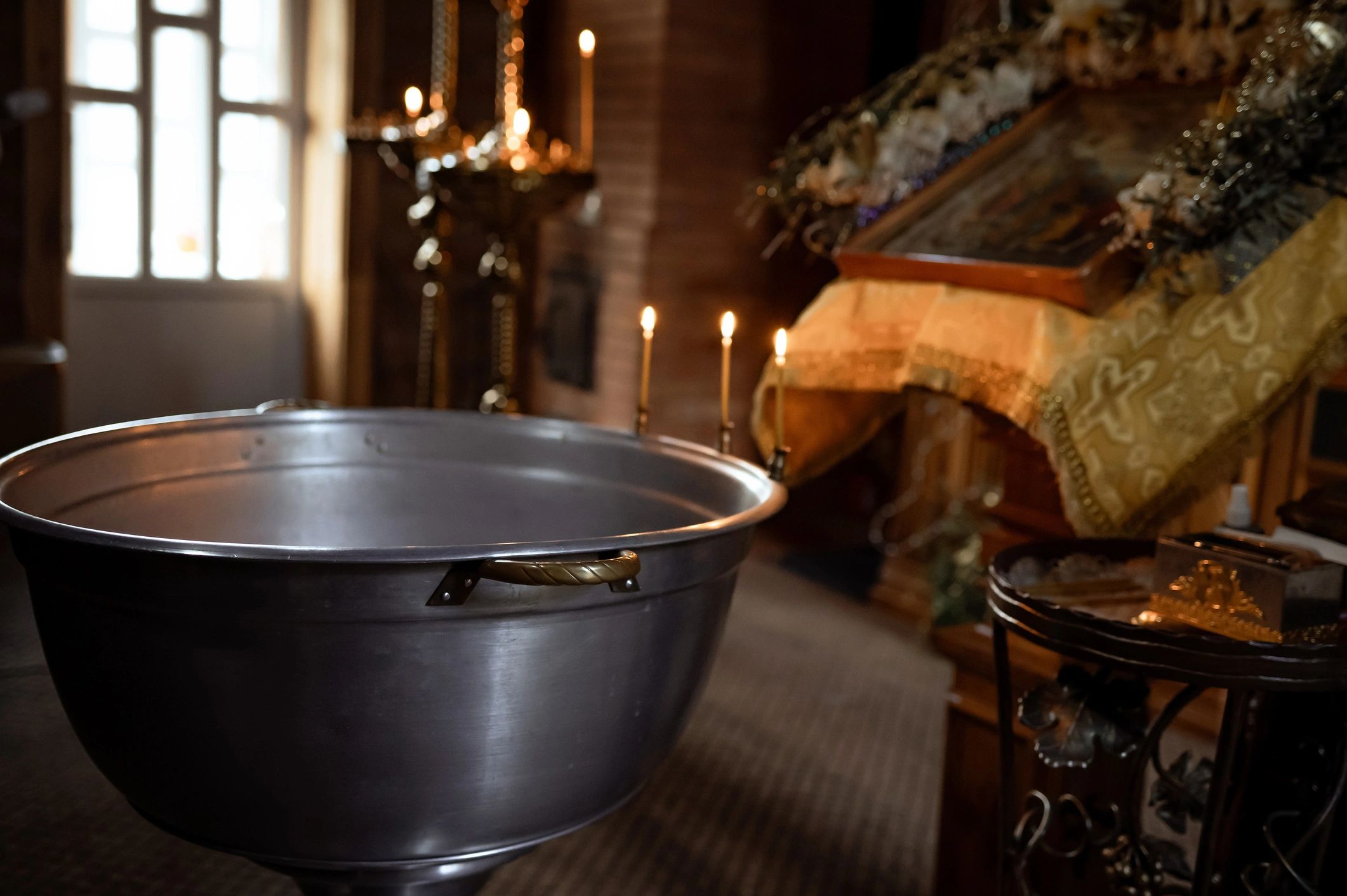 Orthodox church interior with candles and icon stand