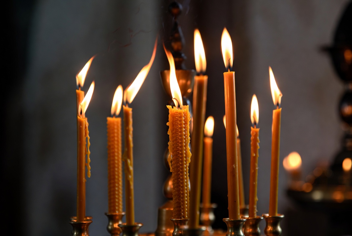 Lit candles in an Orthodox church