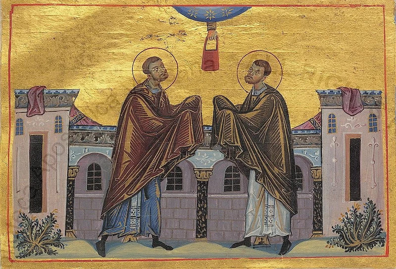 Byzantine miniature: Sts. Cosmas and Damian standing before buildings beneath a heavenly blessing.