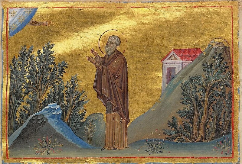 Byzantine miniature: St. Joannicius standing in prayer among trees and rocky hills.