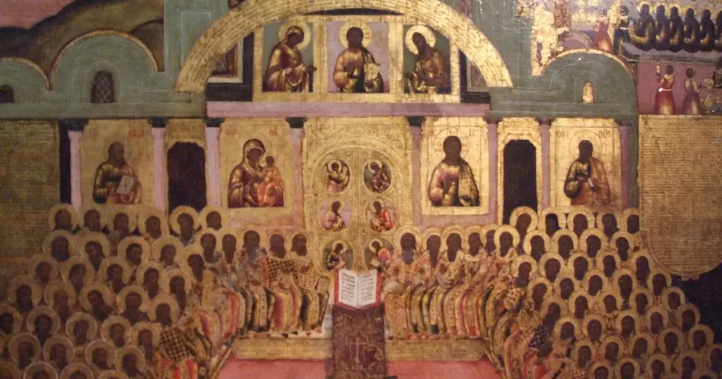 Russian icon of the Seventh Ecumenical Council: rows of haloed bishops seated before an iconostasis, with an open Gospel book enthroned on a stand at the center.